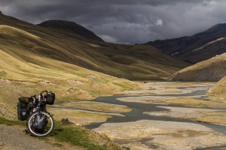 A magical moment after riding through sleet and snow the whole morning crossing the rugged 3800m high Tosor Pass in Kyrgyzstan.